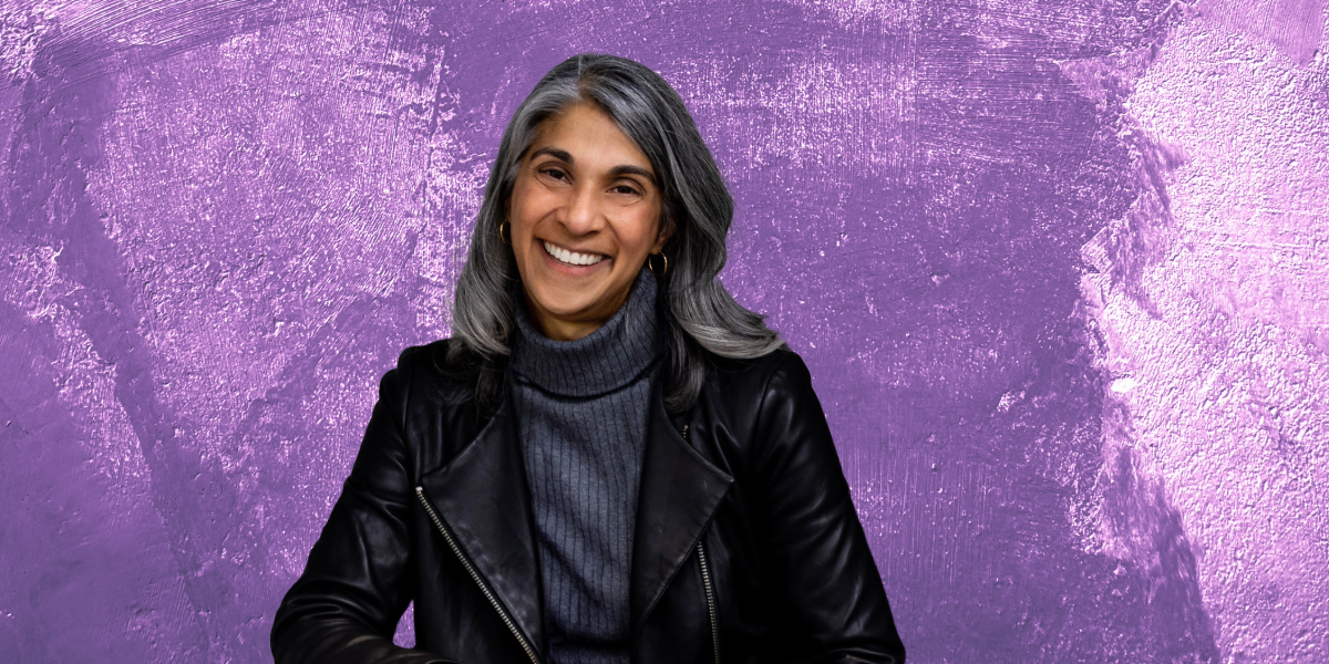Headshot of Lisa Dhar against a purple background