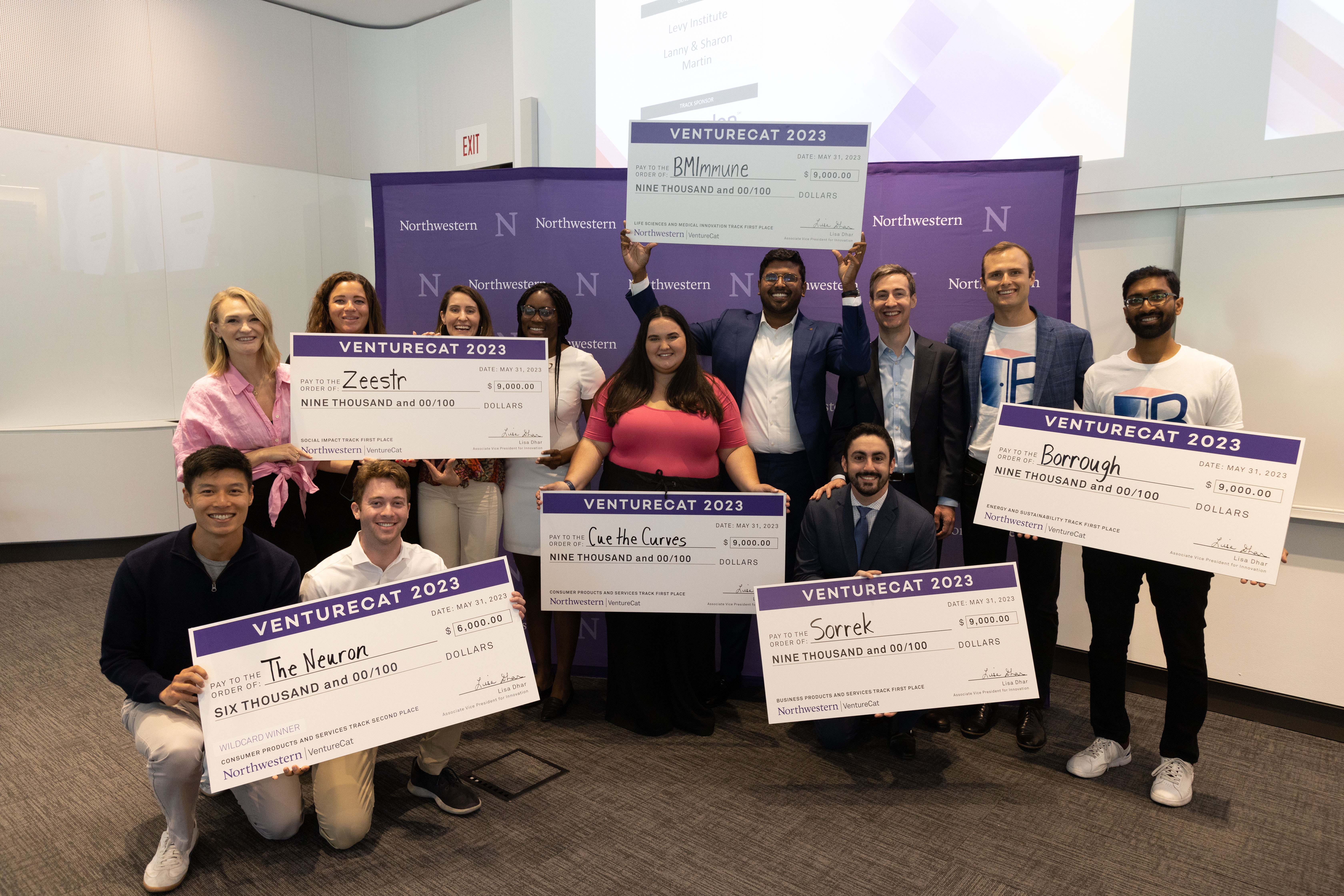 2023 VentureCat finalists pose with their awards. Charlotte Oxnam (in red), McCormick ‘23, won the grand prize for her plus-size social shopping app, Cue the Curves.