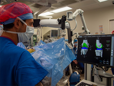 Doctors working with robotic arm of Mako SmartRobotics